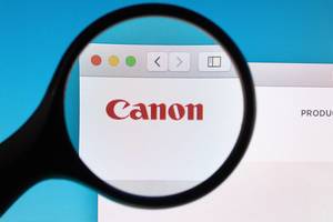 Canon logo under magnifying glass