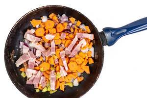 Carrot Paprika and Bacon in the frying pan