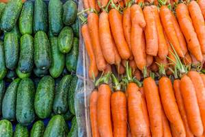 Carrots and cucumbers on marketplace