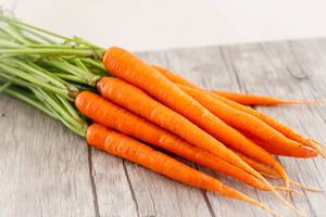 Carrots Close-up on a Wooden Background