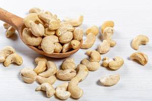 Cashew nuts in a wooden spoon
