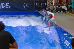 Catching the wave on a Citywave surf machine at fair Boot Düsseldorf 2018