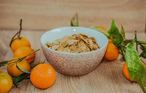 Cereal In A Bowl And Tangerines