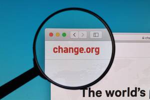 Change.org logo under magnifying glass