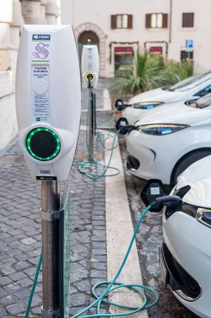 Charging electric cars at e-stations in Rome, Italy