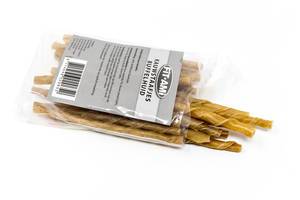 Chewing sticks for dogs made of buffalo skin in plastic bag against white background
