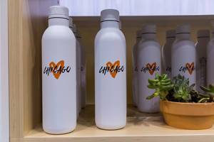 Chicago love sales article for city marathon: White water bottles with orange heart symbol
