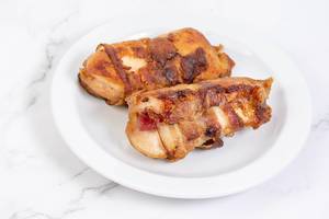 Chicken Meat stuffed with cheese and rolled in bacon