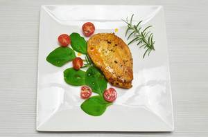 Chicken schnitzel with cherry tomatoes and spinach