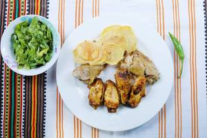 Chicken wings and fried potatoes with lettuce salad (Flip 2019)