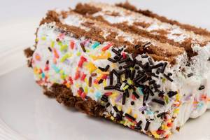 Chocolate Cake slice with Colorful Sprinkles on the top