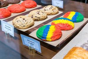Chocolate chip cookies and rainbow cookies on display at For Five Coffee Roasters in Chicago