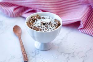 chocolate mousse with wooden spoon in sa white bowl