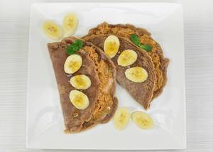 Chocolate pancakes with peanut butter and banana