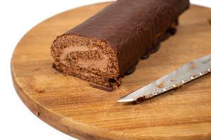 Chocolate Roll cake sliced on the wooden board