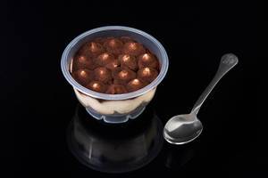 Chocolate souffle in the plastic bowl with spoon (Flip 2019) (Flip 2019)
