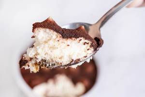 Chocolate souffle in the spoon with blurred background