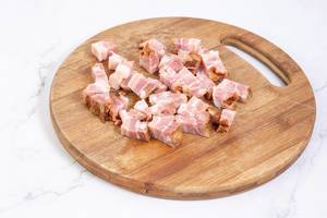 Chopped Bacon on the wooden cutting board