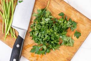 Chopped Parsley on the wooden board (Flip 2019)