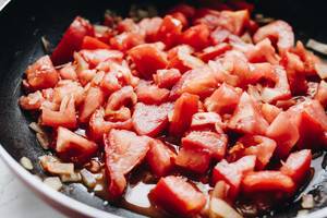 Chopped tomatoes in a pan. Cooking tomatoes