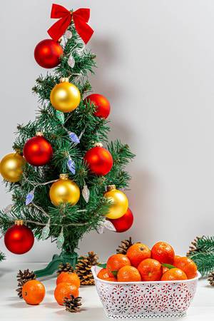 Christmas background with decorated Christmas tree and tangerines (Flip 2019)