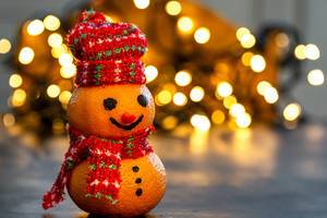 Christmas background with tangerine snowman