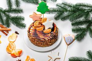 Christmas cake with gingerbread and tangerines on New year background (Flip 2019)