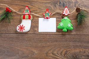 Christmas decor with thread on brown wooden background with free space (Flip 2019)