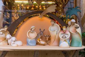 Christmas market sells Porcelain figurines like Baby Jesus for nativity scene