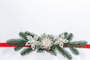 Christmas white background with Christmas tree branches, decor and red ribbon (Flip 2019)