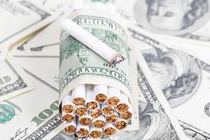 Cigarettes and dollars. Bad habits cost concept