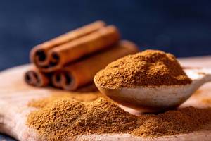 Cinnamon ground in a wooden spoon