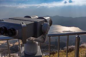 Close Up Bokeh Photo of Binoculars on Mount Hakone with Lake Kawaguchiko in the Background in Yamanashi Prefecture, Japan