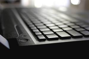 Close Up Bokeh Photo of Black Laptop Keyboard