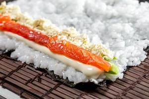 Close-up filling for sushi rolls on dried seaweed nori (Flip 2019)