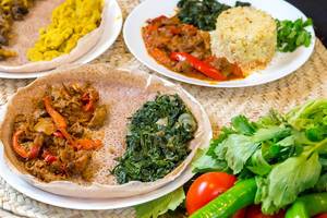 Close Up Food Photo of Eritrea Cuisine Injera and other Dishes