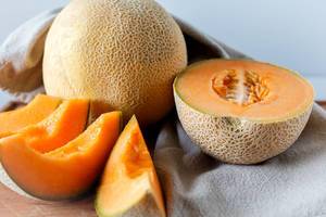 Close Up Food Photo of fresh sliced Cantaloupe Melon on Kitchen Cloth