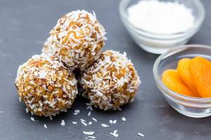 Close Up Food Photo of Homemade Energy Balls with Coconut Rasps and Apricots