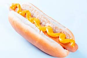 Close Up Food Photo of Hot Dog with Mustard on top on white Background