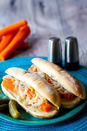 Close Up Food Photo of Vegan Hot Dog with Carrots, Pickled Vegetables, Pickles and Mustard