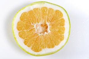 Close up half Citrus Sweetie (Oroblanco ) on white background (Flip 2019)