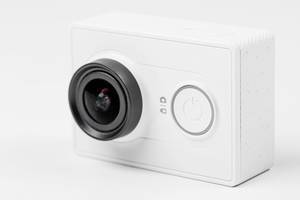 Close up of a white action camera on a white background (Flip 2020)