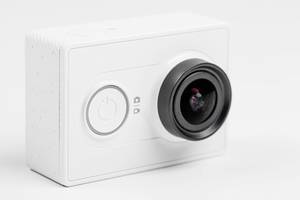 Close up of a white action camera on a white background