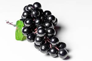 Close-up of black grapes on a white background (Flip 2020)