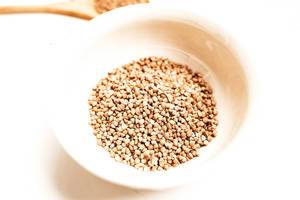 Close up of bowl of raw buckwheat groats