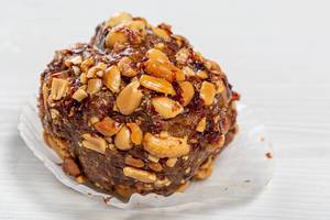 Close-up of cake with cocoa and roasted peanuts