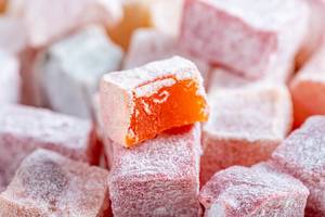 Close-up of candied fruit in powdered sugar (Flip 2019)