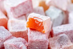 Close-up of candied fruit in powdered sugar