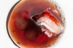 Close-up of cherry brandy with real cherries and ice. Top view