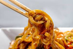 Close up of chinese noodles in spicy sauce and chopsticks (Flip 2019)